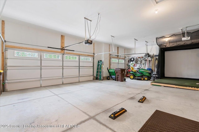 6619 Windford Ln, Grand Ledge, MI 48837 - garage featuring a garage door opener