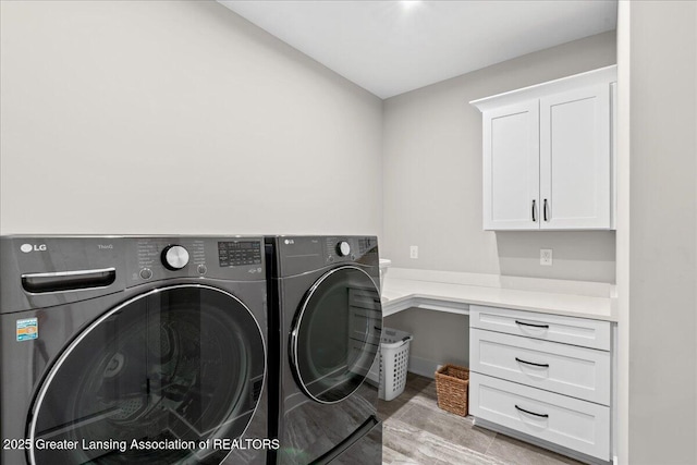6619 Windford Ln, Grand Ledge, MI 48837 - laundry room featuring cabinet space and washing machine and clothes dryer