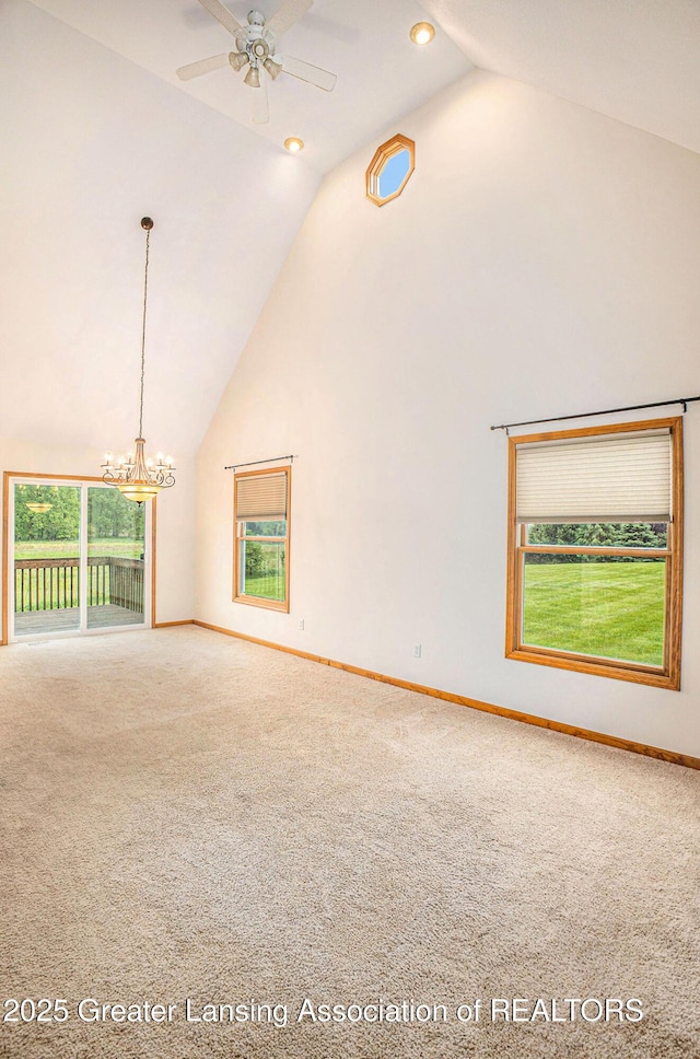 3037 Hawley Rd, Leslie, MI 49251 - unfurnished living room with high vaulted ceiling, carpet floors, a chandelier, baseboards, and a ceiling fan