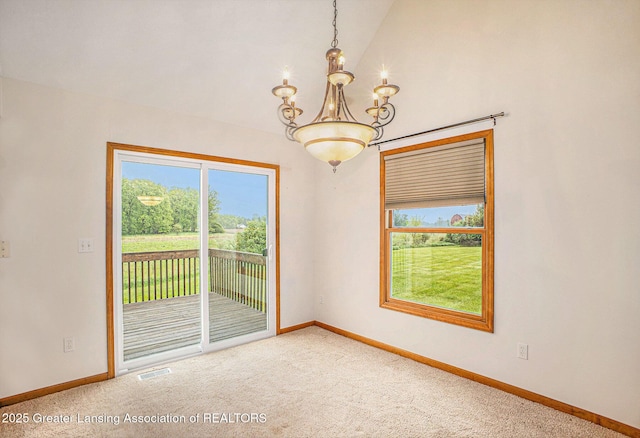 3037 Hawley Rd, Leslie, MI 49251 - empty room featuring a chandelier, carpet, vaulted ceiling, and baseboards