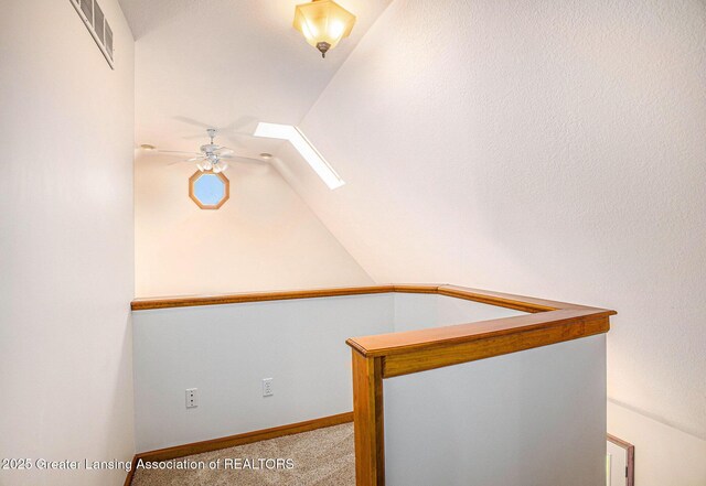 3037 Hawley Rd, Leslie, MI 49251 - additional living space featuring ceiling fan, a skylight, lofted ceiling, carpet floors, and baseboards