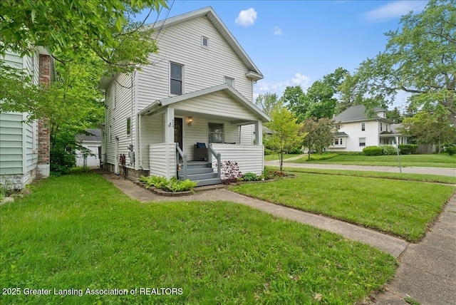 329 Smith Ave, Lansing, MI 48910 - view of front of house with covered porch and a front lawn