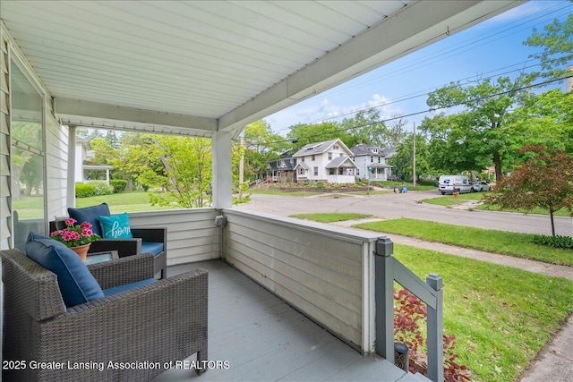 329 Smith Ave, Lansing, MI 48910 - porch with a residential view and a lawn