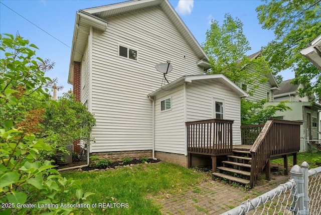 329 Smith Ave, Lansing, MI 48910 - back of house featuring a deck