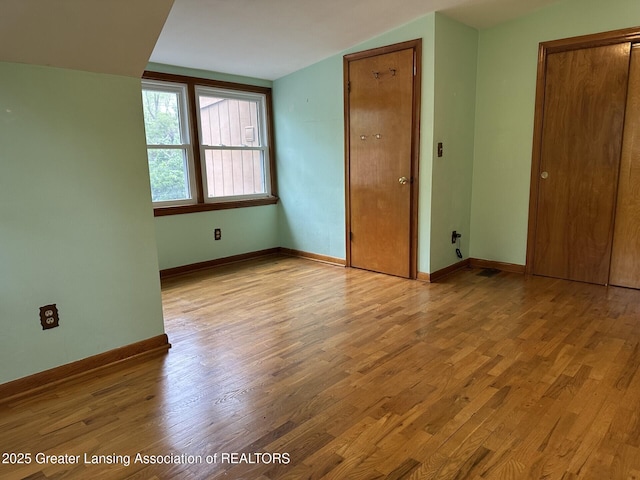 710 Gainsborough Dr, East Lansing, MI 48823 - unfurnished bedroom featuring light wood finished floors, baseboards, and a closet