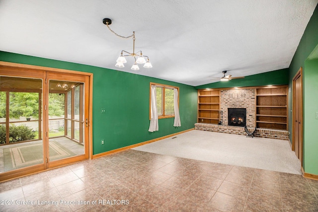 710 Gainsborough Dr, East Lansing, MI 48823 - unfurnished living room with a ceiling fan, baseboards, a textured ceiling, a fireplace, and vaulted ceiling
