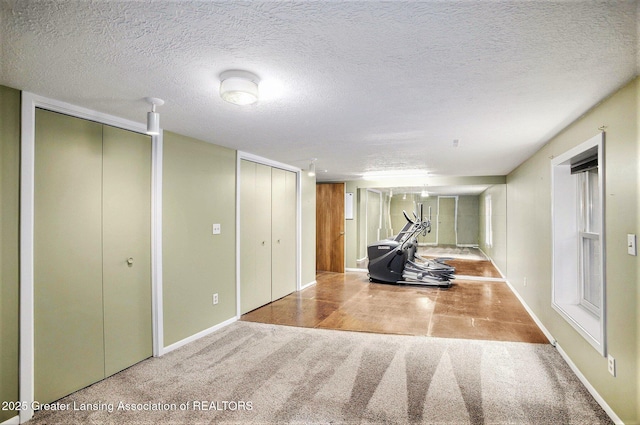 710 Gainsborough Dr, East Lansing, MI 48823 - finished basement featuring carpet floors, baseboards, and a textured ceiling