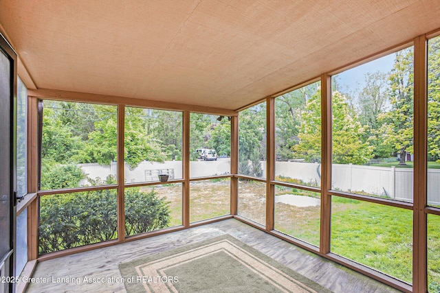 710 Gainsborough Dr, East Lansing, MI 48823 - unfurnished sunroom with view of scattered trees