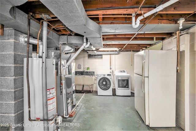 710 Gainsborough Dr, East Lansing, MI 48823 - unfinished below grade area with freestanding refrigerator, separate washer and dryer, water heater, and a sink
