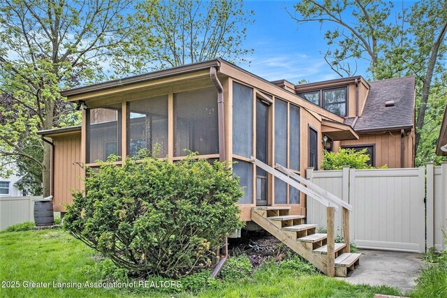 710 Gainsborough Dr, East Lansing, MI 48823 - view of property exterior with a sunroom