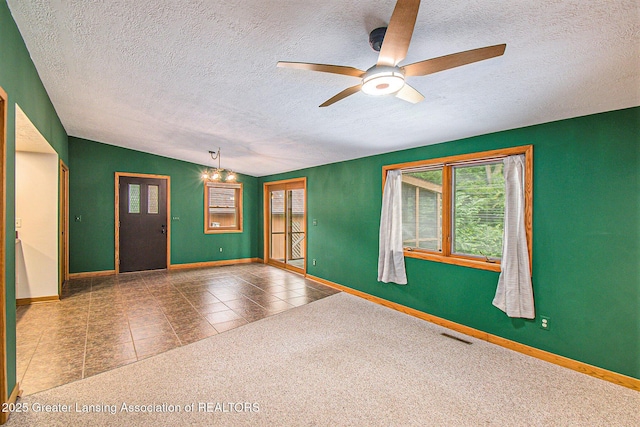 710 Gainsborough Dr, East Lansing, MI 48823 - carpeted spare room featuring healthy amount of natural light, a textured ceiling, ceiling fan, and tile patterned flooring