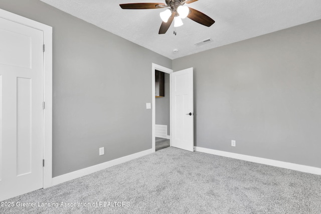 209 Haze St, Lansing, MI 48917 - unfurnished bedroom featuring carpet, baseboards, and ceiling fan
