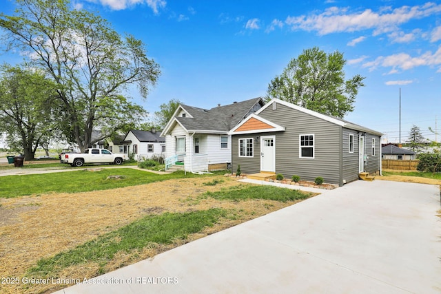 209 Haze St, Lansing, MI 48917 - view of front of home with concrete driveway and a front yard