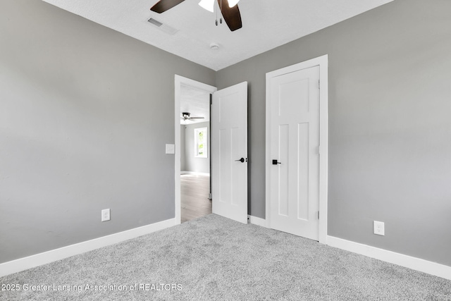 209 Haze St, Lansing, MI 48917 - unfurnished bedroom featuring carpet, baseboards, and ceiling fan