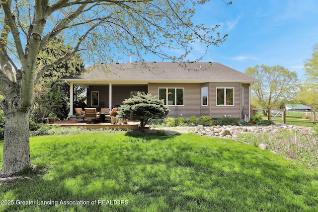 4740 Round Lake Rd, Laingsburg, MI 48848 - back of house with an outdoor living space and a patio