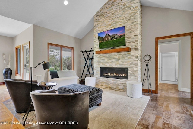 4740 Round Lake Rd, Laingsburg, MI 48848 - living area with high vaulted ceiling, a stone fireplace, and baseboards