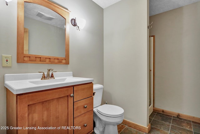 4740 Round Lake Rd, Laingsburg, MI 48848 - bathroom featuring toilet, vanity, baseboards, a shower stall, and a textured ceiling