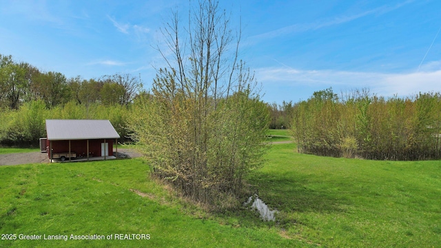4740 Round Lake Rd, Laingsburg, MI 48848 - view of green lawn featuring an outbuilding and an outdoor structure