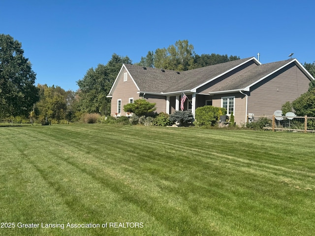 4740 Round Lake Rd, Laingsburg, MI 48848 - view of front of house featuring a front yard and roof with shingles