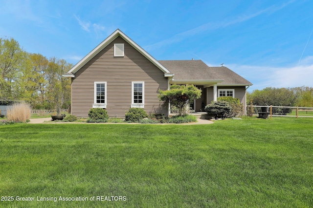 4740 Round Lake Rd, Laingsburg, MI 48848 - view of front facade with a front yard and roof with shingles