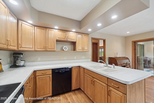 10949 Lakeside Dr, Perrinton, MI 48871 - kitchen with dishwasher, a sink, a peninsula, light wood finished floors, and recessed lighting