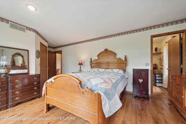 10949 Lakeside Dr, Perrinton, MI 48871 - bedroom featuring wood finished floors