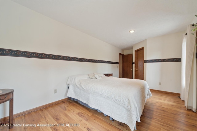 10949 Lakeside Dr, Perrinton, MI 48871 - bedroom featuring baseboards, light wood finished floors, and recessed lighting
