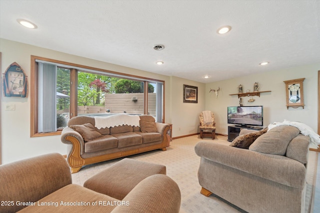 10949 Lakeside Dr, Perrinton, MI 48871 - living room featuring light colored carpet, recessed lighting, and baseboards