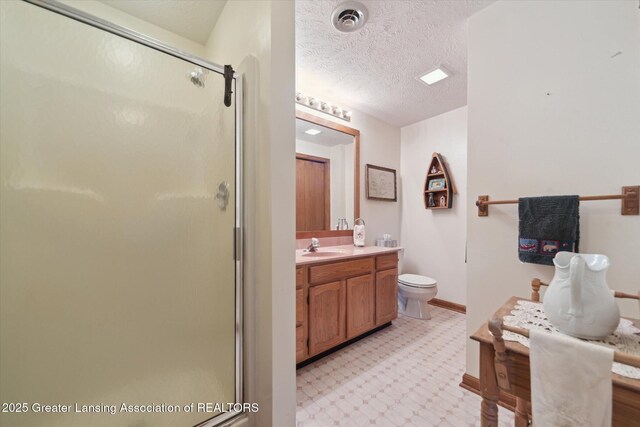 10949 Lakeside Dr, Perrinton, MI 48871 - full bathroom featuring a stall shower, vanity, tile patterned floors, toilet, and a textured ceiling