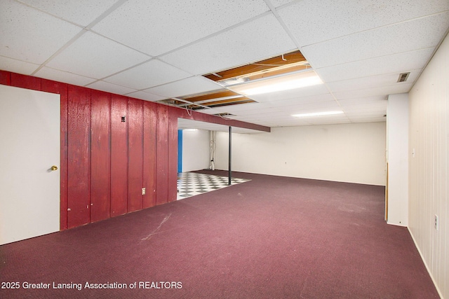 3229 Inverary Dr, Lansing, MI 48911 - finished basement featuring carpet flooring, a paneled ceiling, and wood walls