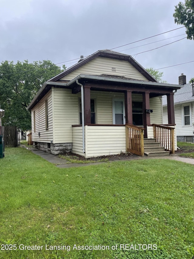 1846 Davis Ave, Lansing, MI 48910 - view of front of home featuring a porch and a front yard