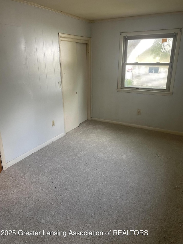 1846 Davis Ave, Lansing, MI 48910 - unfurnished bedroom with carpet floors and a closet