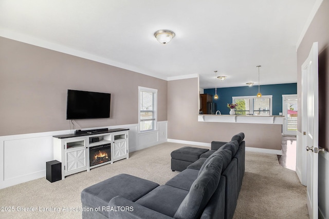 15145 Nottingham Fields Pkwy, Lansing, MI 48906 - carpeted living area featuring a wainscoted wall