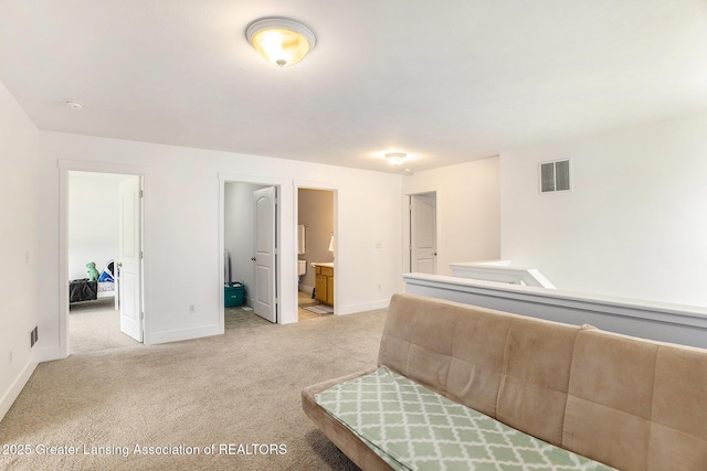 15145 Nottingham Fields Pkwy, Lansing, MI 48906 - bedroom featuring light carpet, baseboards, and ensuite bathroom