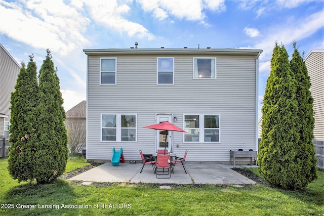 15145 Nottingham Fields Pkwy, Lansing, MI 48906 - rear view of property with a patio area and a lawn