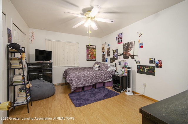 37936 Watkins Dr Unit 32, Sterling Heights, MI 48312 - bedroom with wood finished floors, baseboards, and ceiling fan