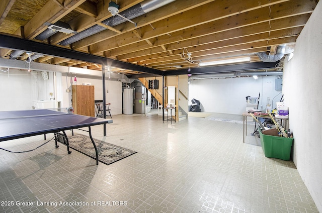 37936 Watkins Dr Unit 32, Sterling Heights, MI 48312 - below grade area featuring washer / clothes dryer, stairway, water heater, and tile patterned floors
