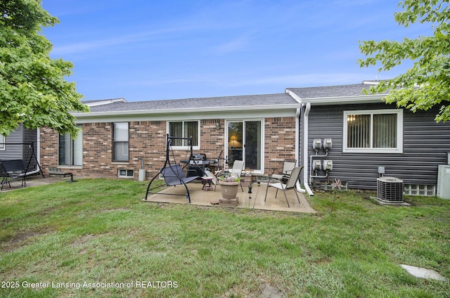 37936 Watkins Dr Unit 32, Sterling Heights, MI 48312 - back of house featuring a patio, brick siding, a lawn, and cooling unit