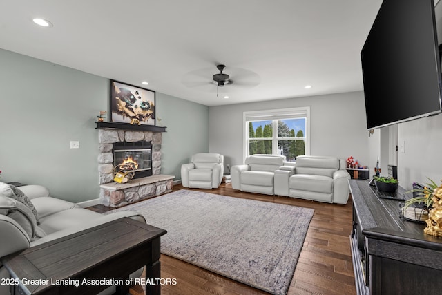 1600 Tuttle Rd, Mason, MI 48854 - living area with ceiling fan, a stone fireplace, recessed lighting, and dark wood finished floors