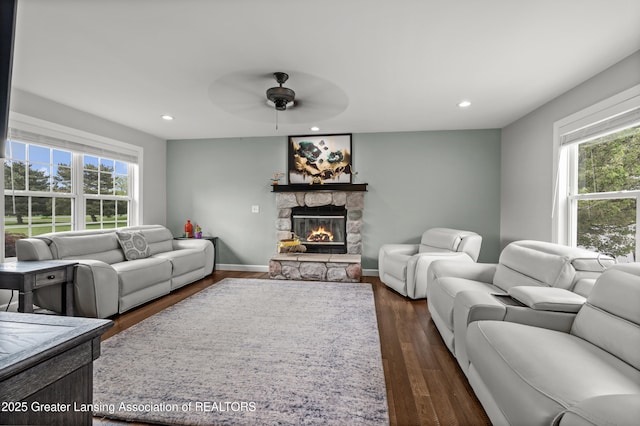 1600 Tuttle Rd, Mason, MI 48854 - living area with plenty of natural light, a ceiling fan, a fireplace, recessed lighting, and dark wood-style floors