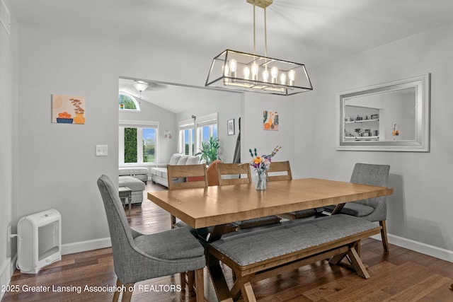 1600 Tuttle Rd, Mason, MI 48854 - dining room with lofted ceiling, wood finished floors, baseboards, a ceiling fan, and a chandelier