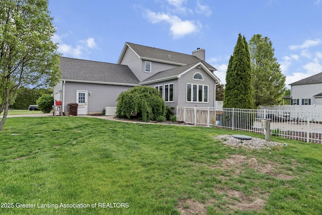 1600 Tuttle Rd, Mason, MI 48854 - rear view of property with a chimney and a shingled roof