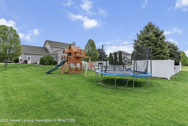 1600 Tuttle Rd, Mason, MI 48854 - view of yard featuring a trampoline and a playground
