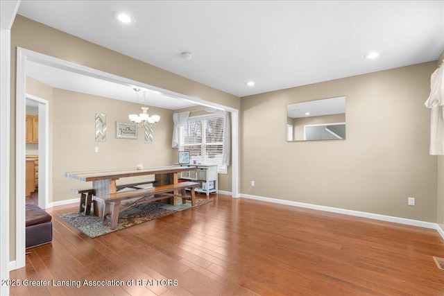 703 Hastay Blvd, Eaton Rapids, MI 48827 - dining room with wood finished floors, baseboards, a chandelier, and recessed lighting