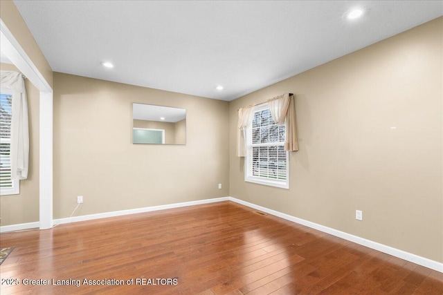 703 Hastay Blvd, Eaton Rapids, MI 48827 - spare room with wood finished floors, baseboards, and recessed lighting