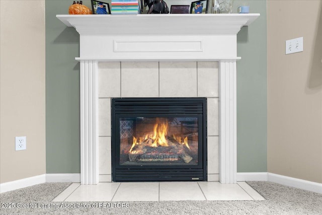 703 Hastay Blvd, Eaton Rapids, MI 48827 - detailed view of a tile fireplace and baseboards