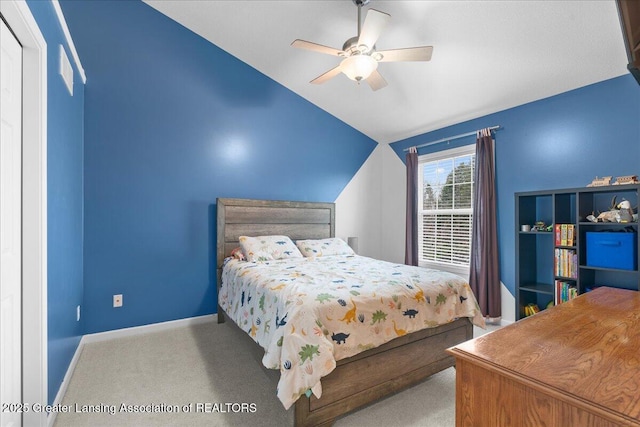 703 Hastay Blvd, Eaton Rapids, MI 48827 - carpeted bedroom featuring lofted ceiling, baseboards, and ceiling fan