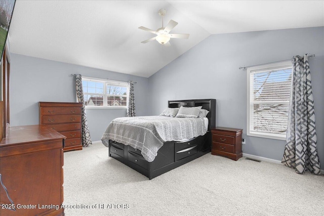 703 Hastay Blvd, Eaton Rapids, MI 48827 - carpeted bedroom with vaulted ceiling, baseboards, and a ceiling fan