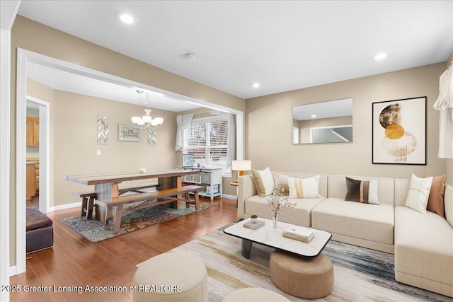 703 Hastay Blvd, Eaton Rapids, MI 48827 - living area featuring wood finished floors, a chandelier, baseboards, and recessed lighting