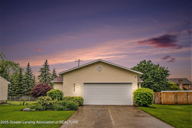 4626 Blackberry Ln, Lansing, MI 48917 - view of front of house with a garage and concrete driveway